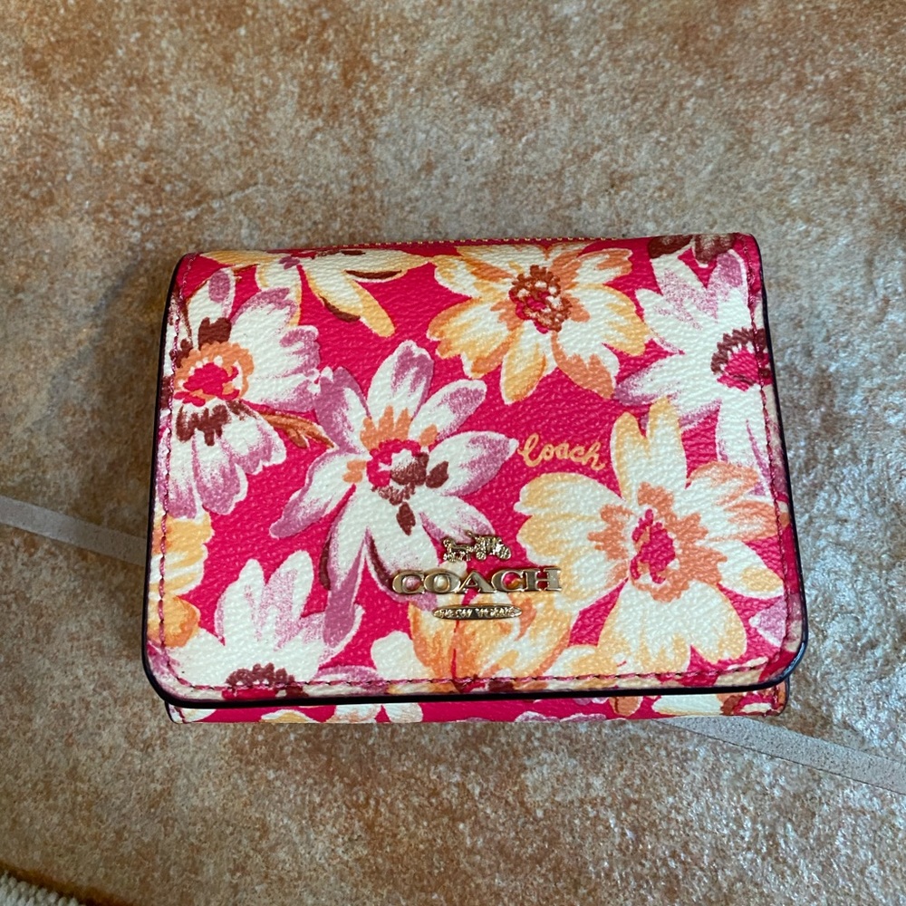 Pink coach, floral, wallet, new with tags.